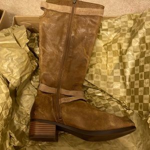 UGG size 8 brown leather boot with tan trim.Never been worn outside. Gorgeous!